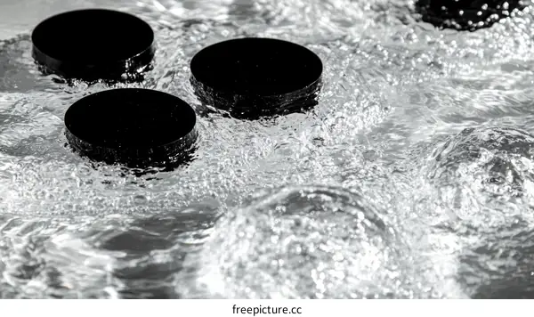 Black Containers in Water Flow