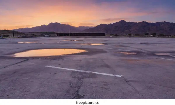 Empty Parking Lot at Sunrise over Mountains