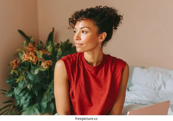 Thoughtful Woman in a Red Tank Top