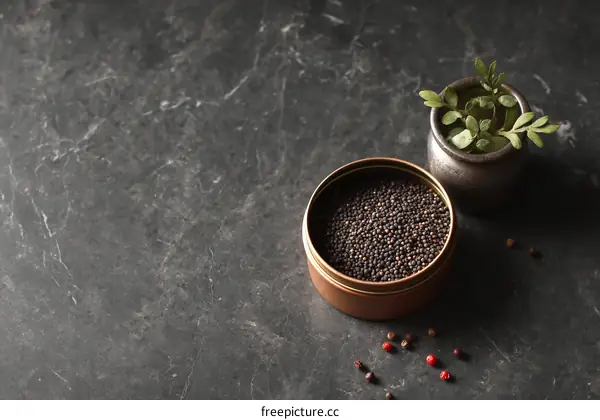 Dark Peppercorns in a Copper Tin on Dark Marble