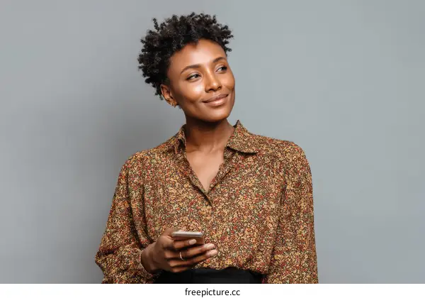 African American Woman Holding Mobile Phone