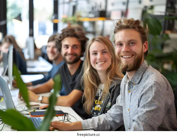 portrait of four smiling people in an office