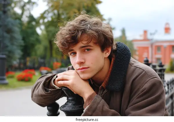 Portrait of a Young Man in Autumn Park