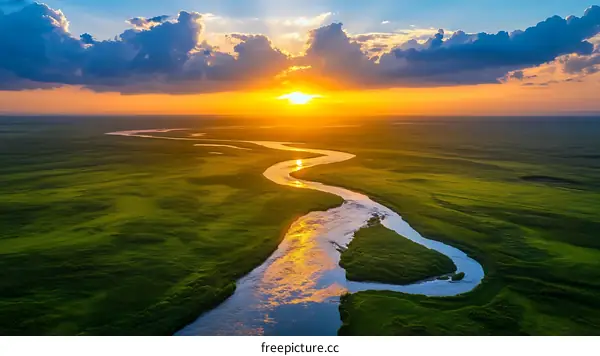 Sunset over a Winding River in a Lush Meadow