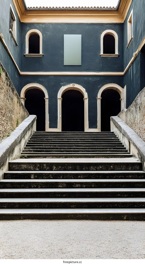 Stone Steps Leading to Arched Entrance of Old Building