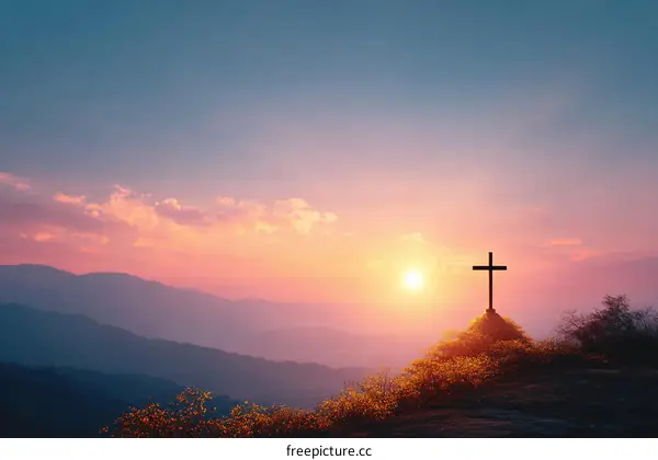 Sunrise over Mountaintop with Cross
