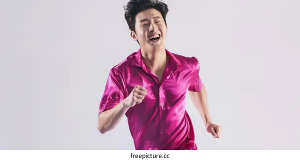 South Korean actor Lee Kwang-soo runs in a pink silk shirt