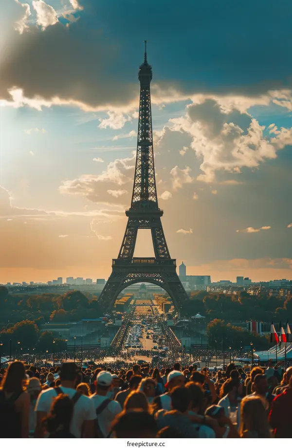 Crowds of people gather at the Eiffel Tower in Paris, France