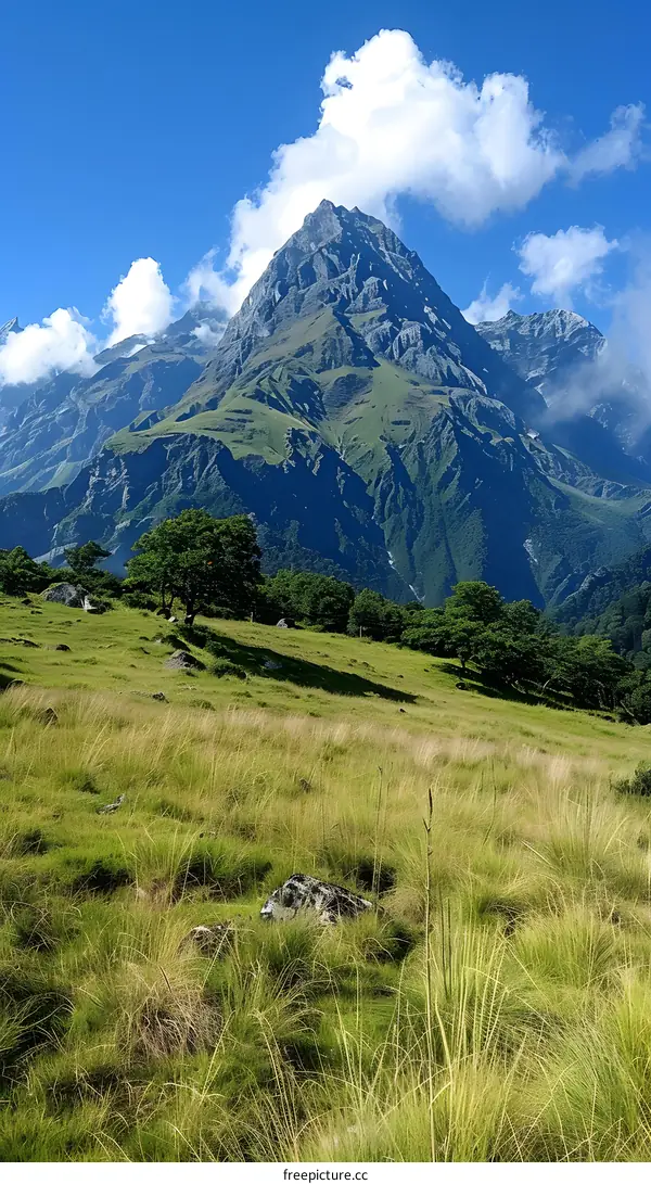 Mountain peak with clouds and blue sky