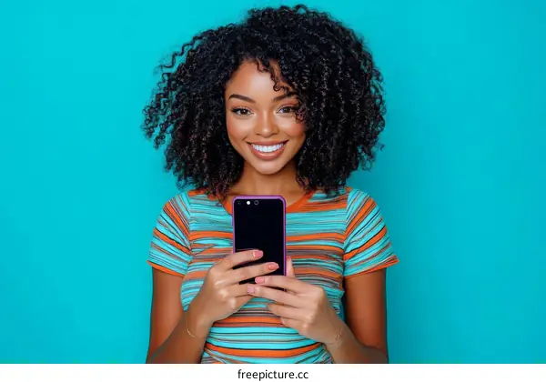 Smiling Black Woman Holding a Phone