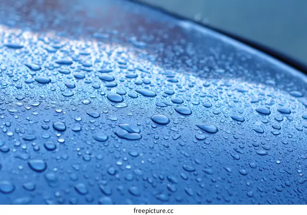 Closeup of Water Droplets on a Blue Surface