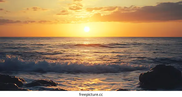 Golden Sunset Over the Ocean Waves