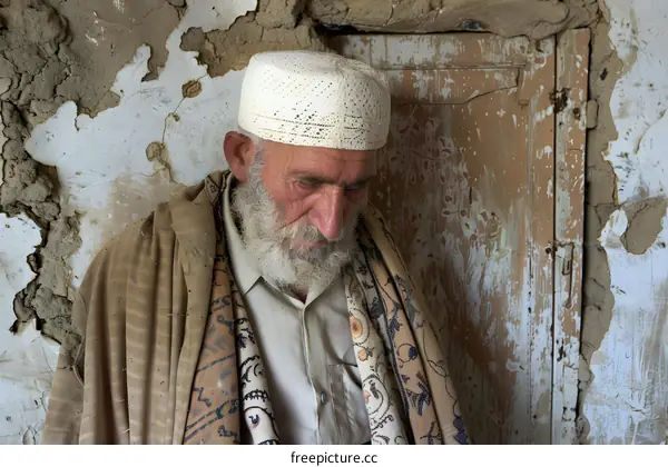 Old Man in Traditional Clothing, Looking Down