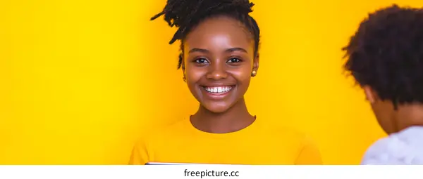 Happy African American Girl Smiling Holding Tablet