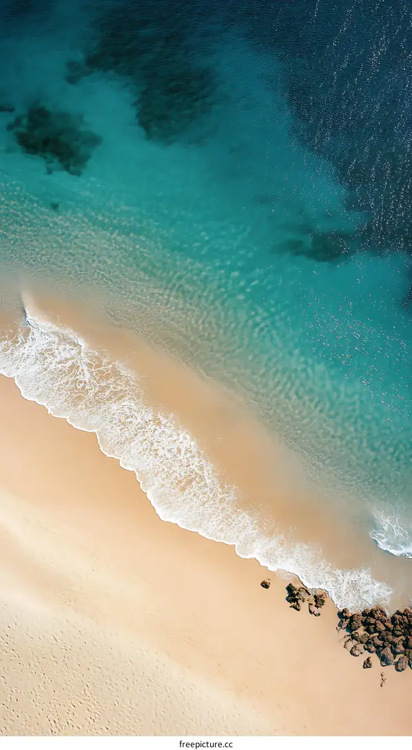 Aerial View of Blue Ocean and Sandy Beach