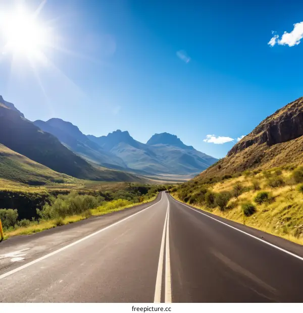 Scenic Road Trip Through Mountain Valley Under Azure Skies