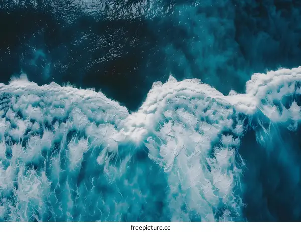 Aerial View of Ocean Waves Breaking