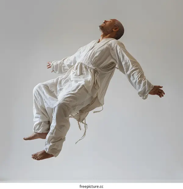 Man in White Floating in Midair