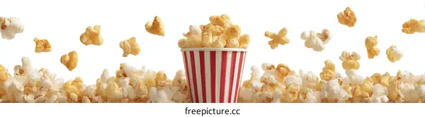 Popcorn Falling from a Striped Paper Cup