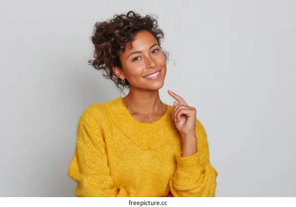 Smiling Woman in a Yellow Sweater
