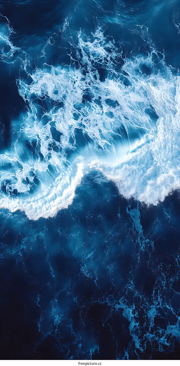 Aerial View of Ocean Waves with White Foam