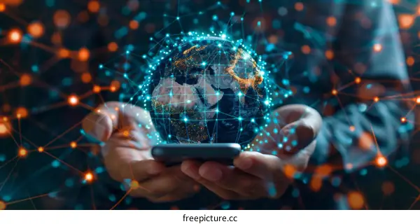 Businessman holding a smartphone with a globe hologram in his hand