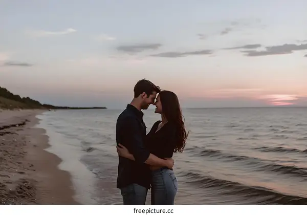 Couple Embracing at Sunset on Sandy Beach