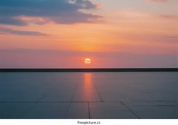 The beautiful sunset over a flat surface with colorful sky