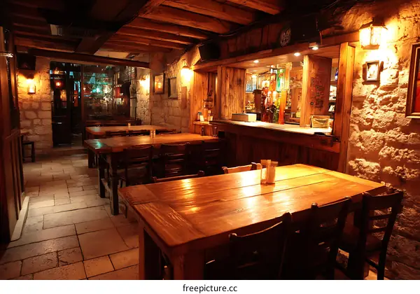 Rustic Pub Interior with Wooden Tables and Stone Walls