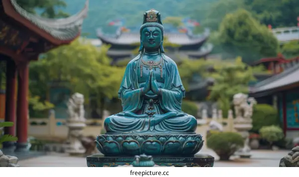 Guanyin statue in a Chinese Buddhist temple with traditional Chinese architecture