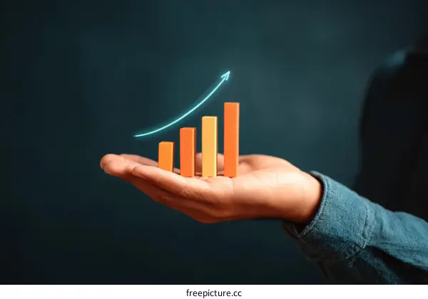 Growth Graph in Hand Showing Business Success