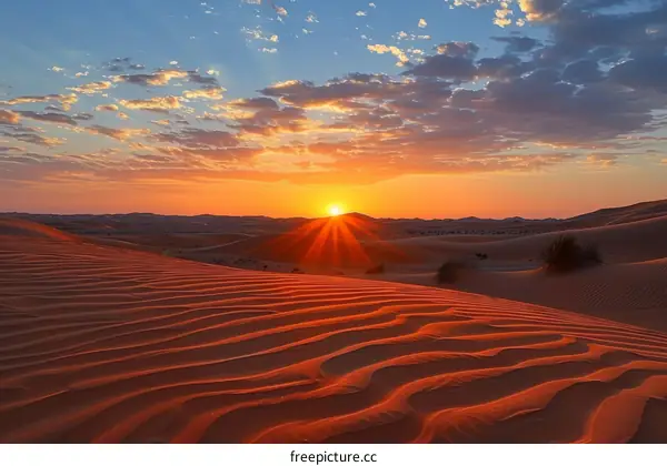 Amazing sunset over the red sand dunes of the Empty Quarter desert in Saudi Arabia