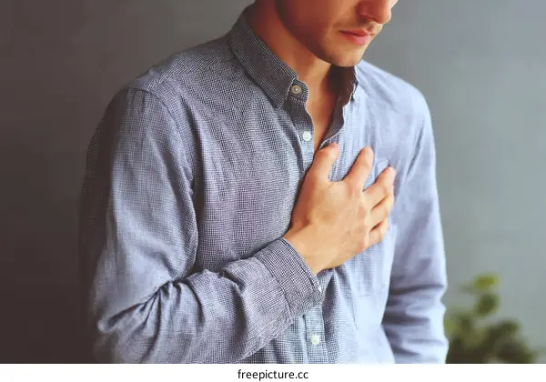 Closeup Caucasian Man Experiencing Chest Pain