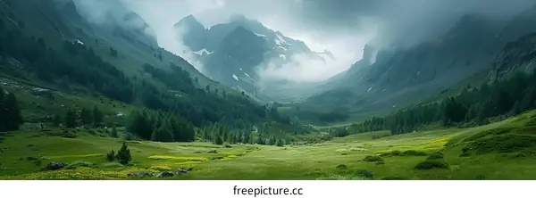 Misty Mountains and Lush Green Valley Landscape