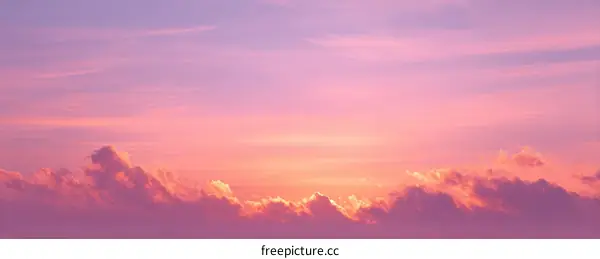 Pastel Sunset Sky with Fluffy Clouds