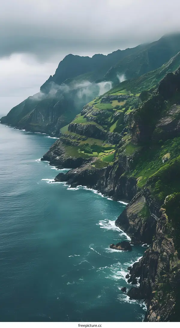 Sea Cliffs and Foggy Mountain Landscape