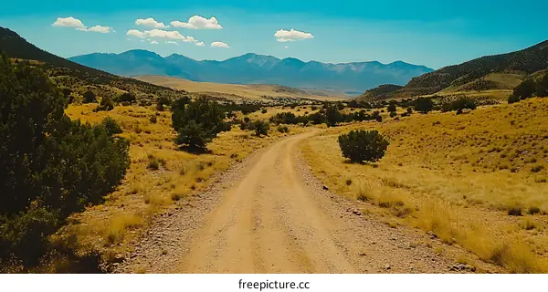Dirt Road Leading to the Mountain Range