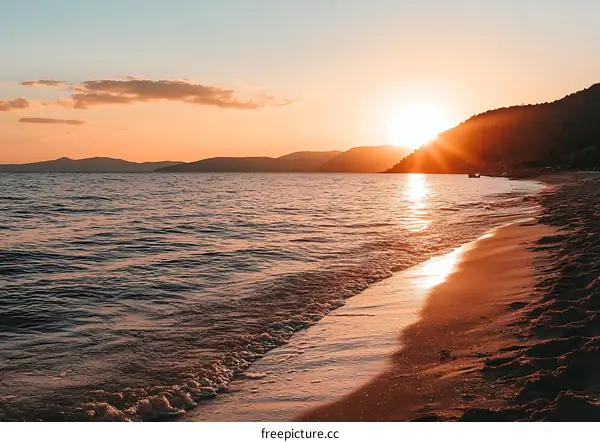 Beautiful Sunset Over Ocean Waves On Sandy Beach