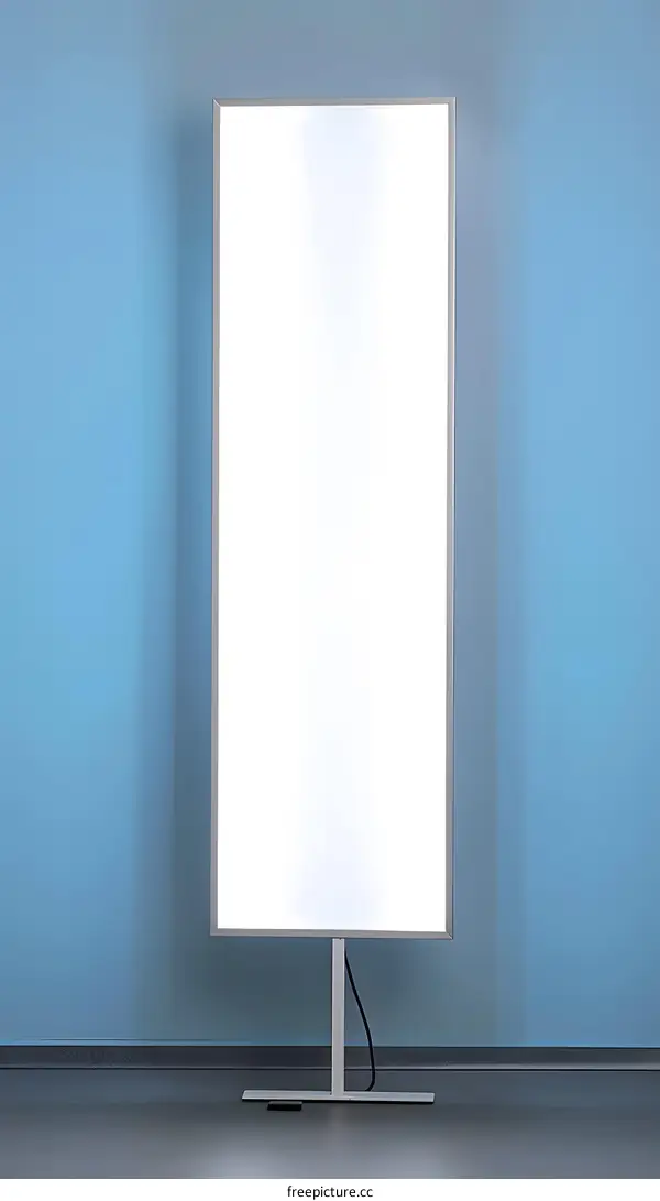 Modern Light Box on a Stand Against a Blue Wall