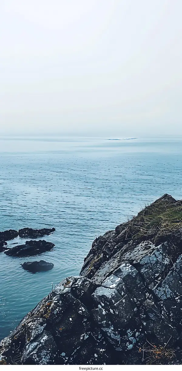 Rocky Coastline with Foggy Horizon