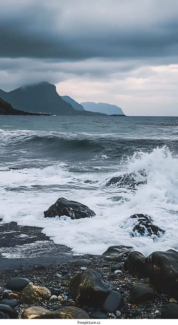Stormy Sea With Mountains In The Background