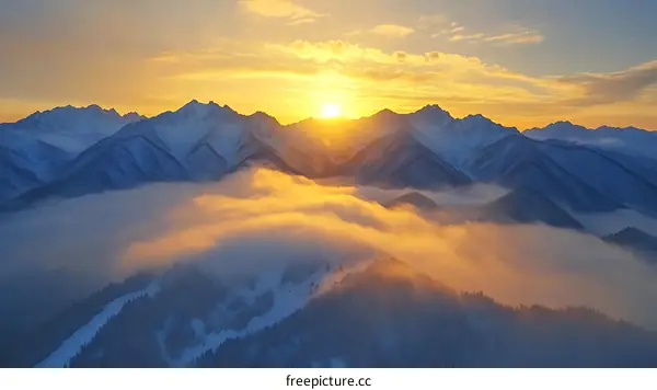 Majestic Sunrise Over Snowy Mountain Peaks