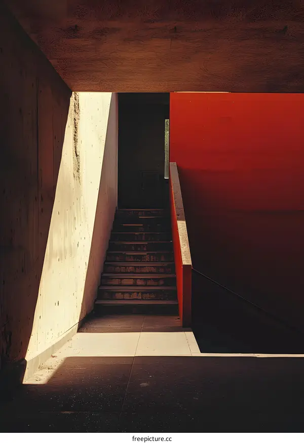 Concrete Stairs with Red Wall in the Building
