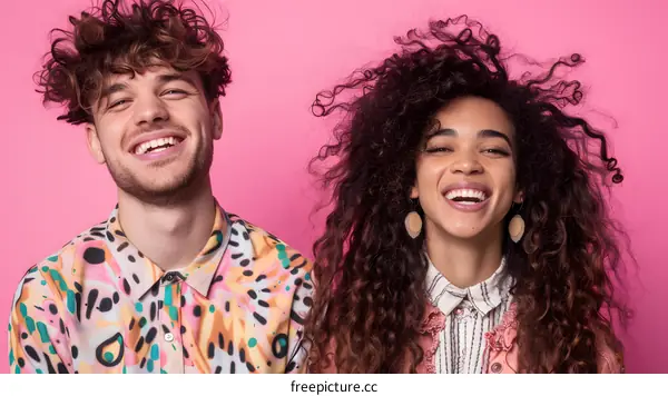 Happy Couple Posing Together in Front of Pink Background