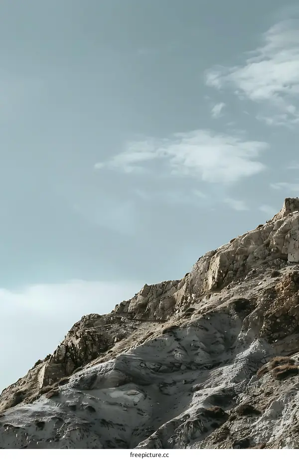 Close Up of Mountain Cliff and Cloudy Sky