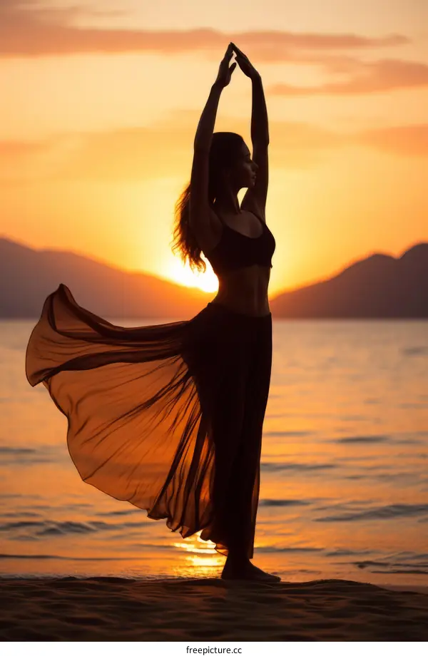 woman in long skirt dancing on beach at sunset