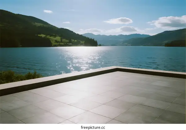 Modern terrace with scenic lake view under bright sun