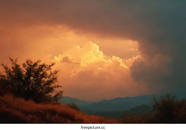 Dramatic Sunset Sky Over Mountains and Desert Landscape