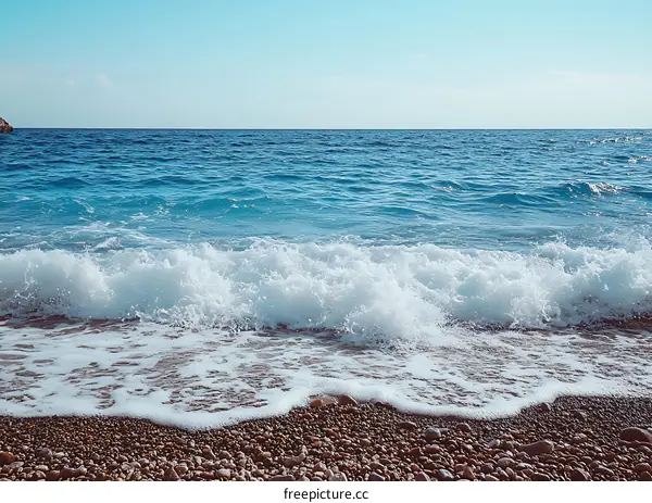 Blue Sea Waves Crashing on a Rocky Beach
