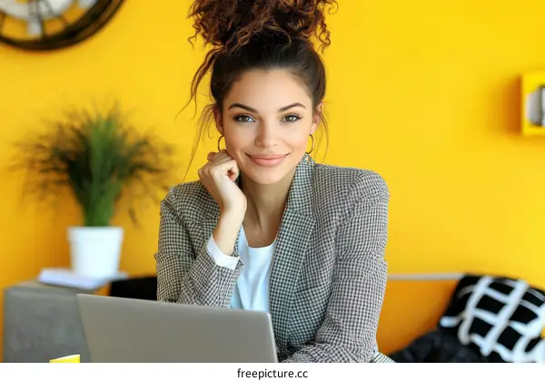 Confident Young Woman Working on a Laptop
